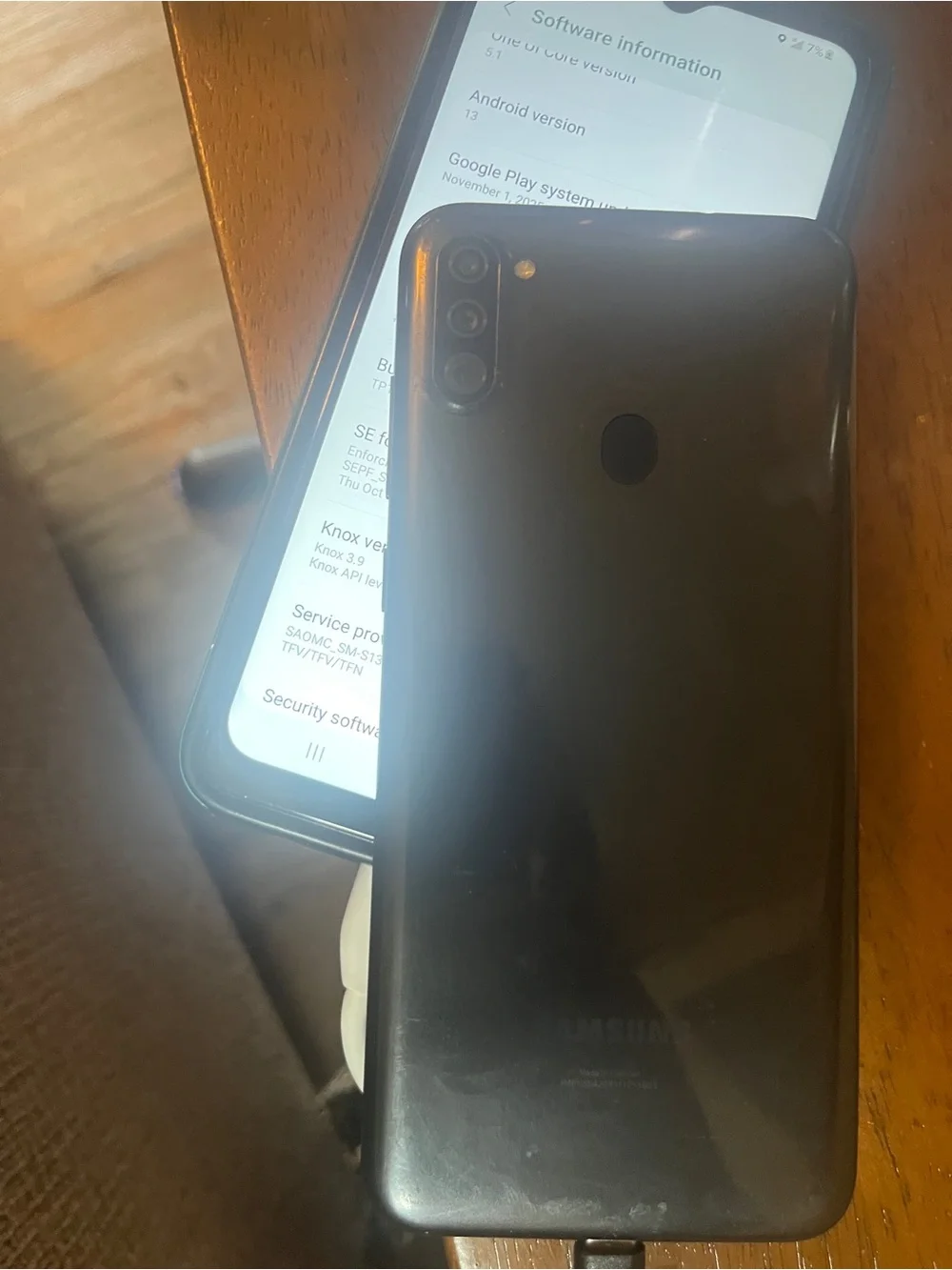 Samsung Smartphone with Black Case and Orange-Purple Home Screen